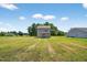 Exterior view of home with neutral siding, and a spacious grassy backyard at 2998 Matthews Mill Pond Rd, Angier, NC 27501