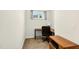This home office features a modern desk, black office chair, and a window at 2998 Matthews Mill Pond Rd, Angier, NC 27501