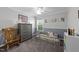 Brightly decorated bedroom with carpeted floor, window, and gray dresser creating a modern and inviting space at 300 Stobhill Ln, Holly Springs, NC 27540