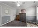 Charming bedroom featuring carpeted floor, closet, window, and a gray dresser, offering both style and functionality at 300 Stobhill Ln, Holly Springs, NC 27540
