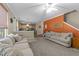 Open concept living room flows into the kitchen with modern neutral decor, and an appealing fireplace feature at 300 Stobhill Ln, Holly Springs, NC 27540