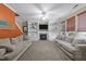 Spacious living room with a fireplace, built-in shelving, and comfortable seating arrangements at 300 Stobhill Ln, Holly Springs, NC 27540