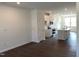 Open concept living space with kitchen, dining, and living area featuring modern finishes at 3113 White Blossom Ct, Raleigh, NC 27610