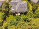 Aerial view of the home showing the backyard with a stone patio and a deck at 315 Birdwood Ct, Cary, NC 27519