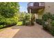 Landscaped backyard patio with a covered deck, perfect for outdoor relaxation and entertaining at 315 Birdwood Ct, Cary, NC 27519