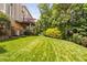 Expansive backyard featuring well-maintained lawn and a covered deck, perfect for entertaining at 315 Birdwood Ct, Cary, NC 27519