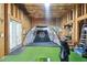 Unfinished basement featuring golf simulator at 315 Birdwood Ct, Cary, NC 27519