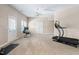 Finished basement with an exercise area and door leading outside at 315 Birdwood Ct, Cary, NC 27519
