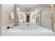 This bathroom features a tub, a large mirror, and a shower at 315 Birdwood Ct, Cary, NC 27519