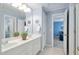 Bathroom with double vanity, mirrors, and white cabinets for a clean, functional design at 315 Birdwood Ct, Cary, NC 27519