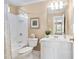 Well-lit bathroom featuring a tub and shower combination, vanity, and plenty of space at 315 Birdwood Ct, Cary, NC 27519