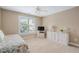 Neutral bedroom with plenty of natural light from the bright window and carpeted floors at 315 Birdwood Ct, Cary, NC 27519