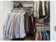 A well-organized closet with multiple rows of hanging space, shelves, and shoe racks at 315 Birdwood Ct, Cary, NC 27519