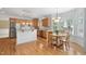 Bright kitchen and breakfast nook with hardwood floors, stainless steel appliances, and natural light at 315 Birdwood Ct, Cary, NC 27519