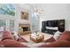 Spacious living room with a fireplace, vaulted ceilings, and large windows at 315 Birdwood Ct, Cary, NC 27519