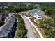 Aerial view of townhomes with a tennis court, playground, and other community features at 3825 Cary Glen Blvd, Cary, NC 27519