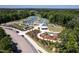 Aerial view of community featuring tennis and pickle ball courts, lush landscaping and a playground at 3825 Cary Glen Blvd, Cary, NC 27519