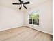 Bedroom with wood-look floors, a ceiling fan, and a window at 3825 Cary Glen Blvd, Cary, NC 27519