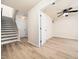 Bedroom with wood-look floors, a ceiling fan, and access to the staircase at 3825 Cary Glen Blvd, Cary, NC 27519