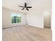Bright bedroom featuring hardwood floors, ceiling fan and a window with beautiful outdoor views at 3825 Cary Glen Blvd, Cary, NC 27519