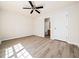 Bedroom with wood-look floors and ensuite bathroom at 3825 Cary Glen Blvd, Cary, NC 27519