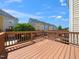 Exterior view of a wood deck with nice wooden rails overlooking the community at 3825 Cary Glen Blvd, Cary, NC 27519