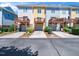 Exterior view of colorful townhomes with private decks and garage parking at 3825 Cary Glen Blvd, Cary, NC 27519