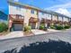 Townhome exteriors with private decks and garage entrances in a vibrant community at 3825 Cary Glen Blvd, Cary, NC 27519