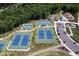 Aerial view of the community tennis courts, playground and parking lot at 3825 Cary Glen Blvd, Cary, NC 27519