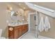 Bright bathroom featuring dual vanity with marble countertop and stylish lighting fixtures at 406 E Whitaker Mill Rd, Raleigh, NC 27608
