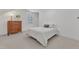 Bright bedroom featuring plush carpet, a dresser, and window at 406 E Whitaker Mill Rd, Raleigh, NC 27608