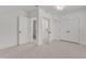 Spacious bedroom featuring neutral carpet, open doorway, and a closet at 406 E Whitaker Mill Rd, Raleigh, NC 27608