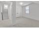 Bright and airy bedroom with neutral carpet, dormer window, and closet at 406 E Whitaker Mill Rd, Raleigh, NC 27608