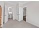 Spacious bedroom with neutral carpet and an ensuite bathroom at 406 E Whitaker Mill Rd, Raleigh, NC 27608