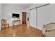 Cozy bedroom with hardwood floors, and a barn door at 406 E Whitaker Mill Rd, Raleigh, NC 27608