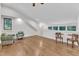 Spacious bonus room with hardwood floors, natural light, and vaulted ceilings at 406 E Whitaker Mill Rd, Raleigh, NC 27608