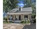 Charming home with stone-accented columns, a covered porch, and meticulous landscaping in a desirable neighborhood at 406 E Whitaker Mill Rd, Raleigh, NC 27608