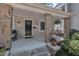 Inviting covered front porch with stylish stone pillars and a cozy hanging bench, perfect for relaxing at 406 E Whitaker Mill Rd, Raleigh, NC 27608