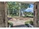 View from front porch, showcasing landscaped front yard with mature trees and a view of the community at 406 E Whitaker Mill Rd, Raleigh, NC 27608