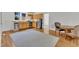 Open kitchen with light wood cabinets, stainless steel appliances, and hardwood floors at 406 E Whitaker Mill Rd, Raleigh, NC 27608