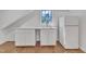 Efficient kitchenette with white cabinetry, solid-surface countertop, stainless sink, and a full-size refrigerator at 406 E Whitaker Mill Rd, Raleigh, NC 27608