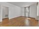 Spacious living room with gleaming hardwood floors and bright, natural light, offering a comfortable living space at 406 E Whitaker Mill Rd, Raleigh, NC 27608