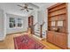 Bright living room boasts hardwood floors, built-in shelving, and a red rug at 406 E Whitaker Mill Rd, Raleigh, NC 27608