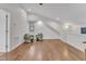 Vaulted upstairs bonus room with wood floors, comfortable chairs, and ample lighting at 406 E Whitaker Mill Rd, Raleigh, NC 27608