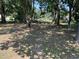 Shaded backyard with large mature trees and plenty of space for outdoor activities and recreation at 417 Sunnyview Rd, Henderson, NC 27536