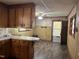 Quaint kitchen with wood cabinets, offering a cozy and functional cooking space at 417 Sunnyview Rd, Henderson, NC 27536