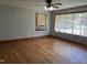 A bright and airy living room with hardwood floors and large windows for natural light at 417 Sunnyview Rd, Henderson, NC 27536