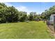 Large backyard with ample green space and mature trees at 4240 Friendship Rock Creek Rd, Burlington, NC 27215
