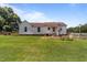 Spacious backyard with a well-maintained lawn and peaceful setting at 4240 Friendship Rock Creek Rd, Burlington, NC 27215