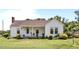 Charming single-story home with a quaint front porch and well-maintained lawn at 4240 Friendship Rock Creek Rd, Burlington, NC 27215